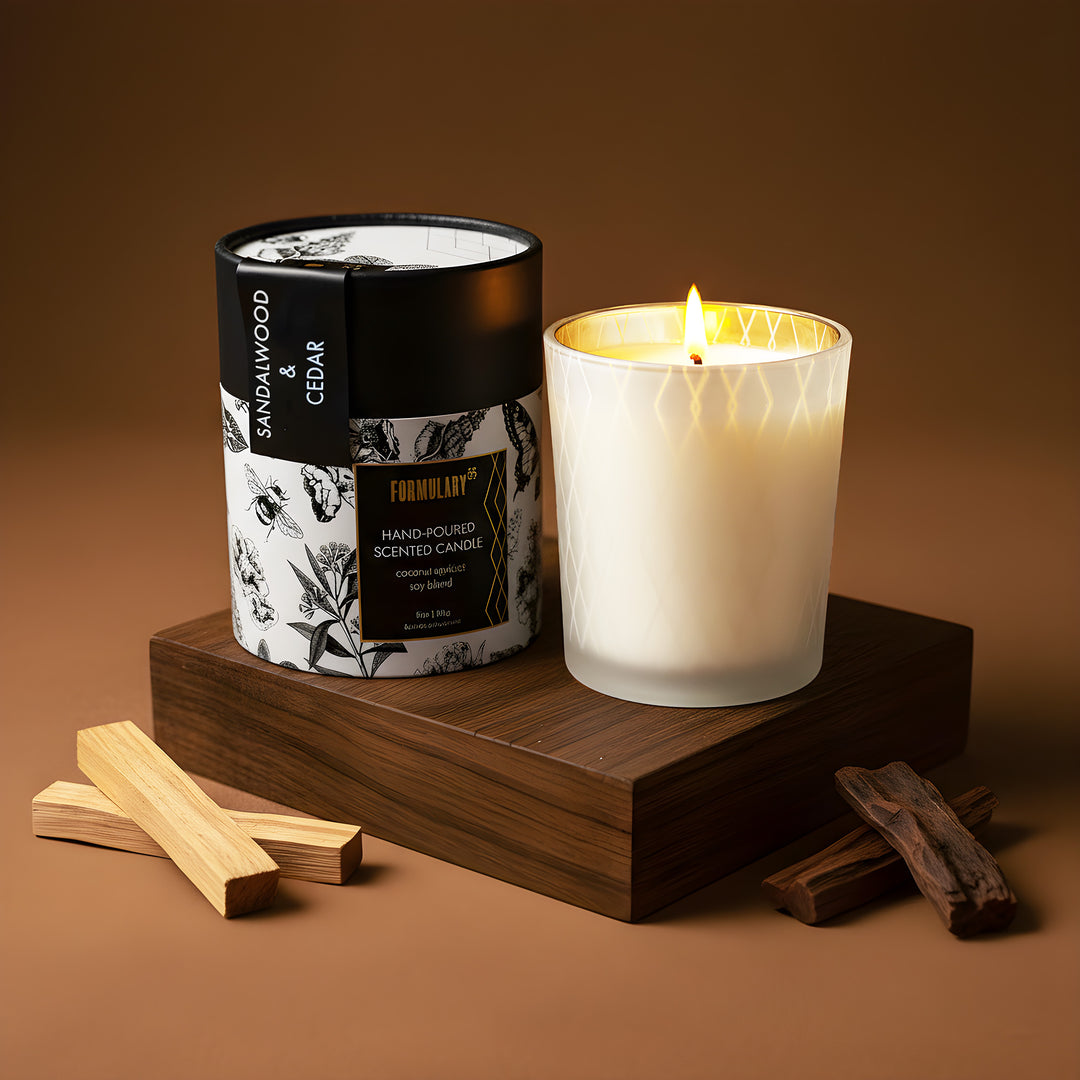 Candle with a labeled container on a wooden stand against a brown background